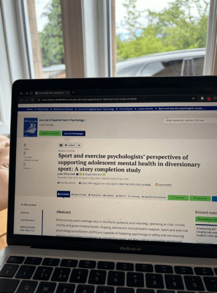 Research and practice displayed on a laptop